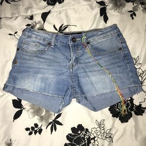 Light blue shorts w/ colorful string